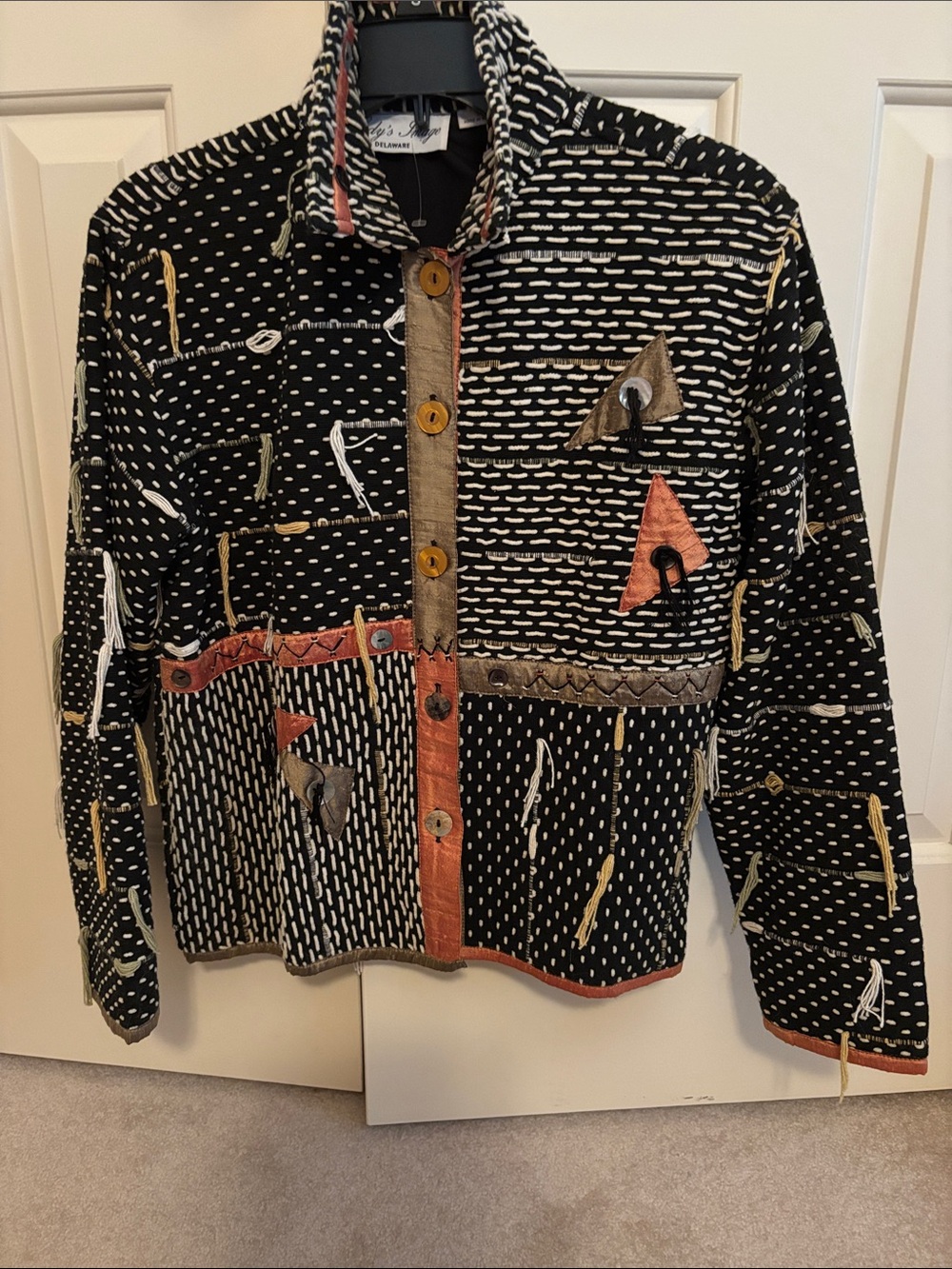 Black Patchwork-Style Jean Jacket with Coral Accents